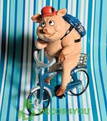 купити Декоративна статуетка Свинка на велосипеді 1