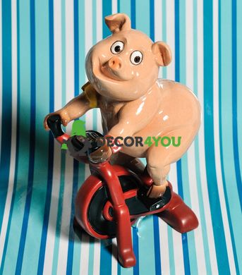 купити Декоративна статуетка Свинка на велотренажері 1